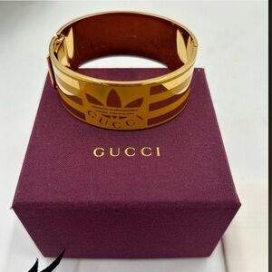 Women’s Gucci X Adidas gold cuff bracelet made in Italy